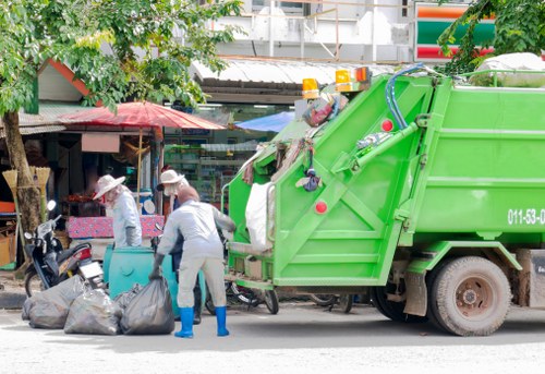 Charity volunteers receiving reused office furniture